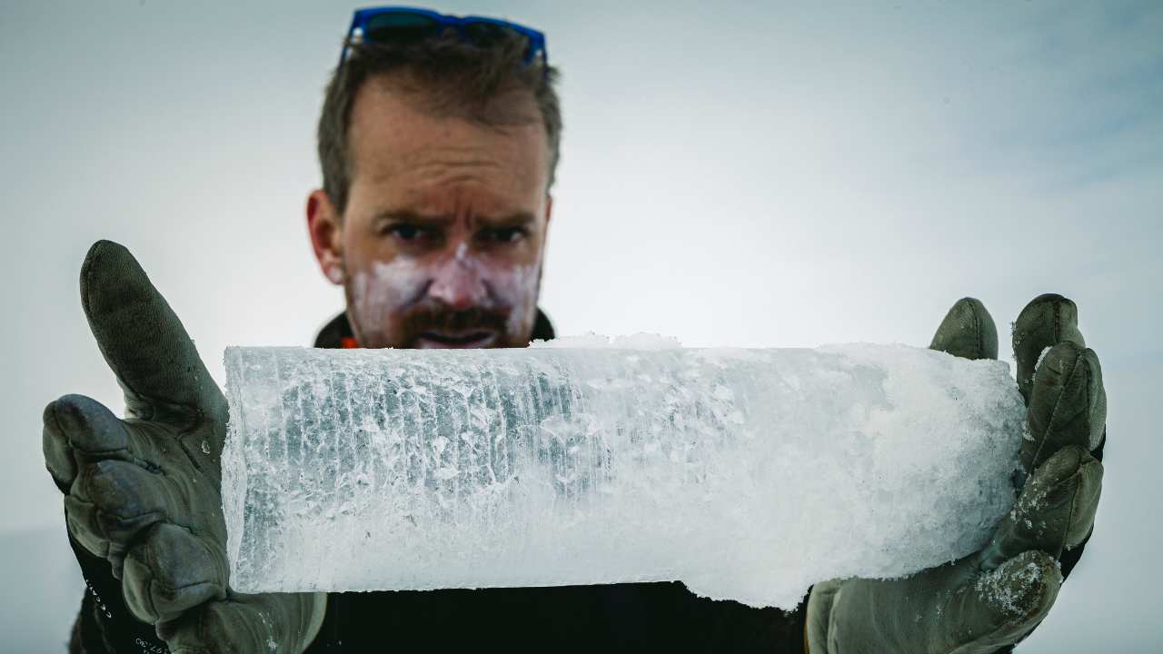 a man holding a block of ice